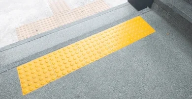 bright yellow tactile paving blind 260nw 2340129041 e1787815803181